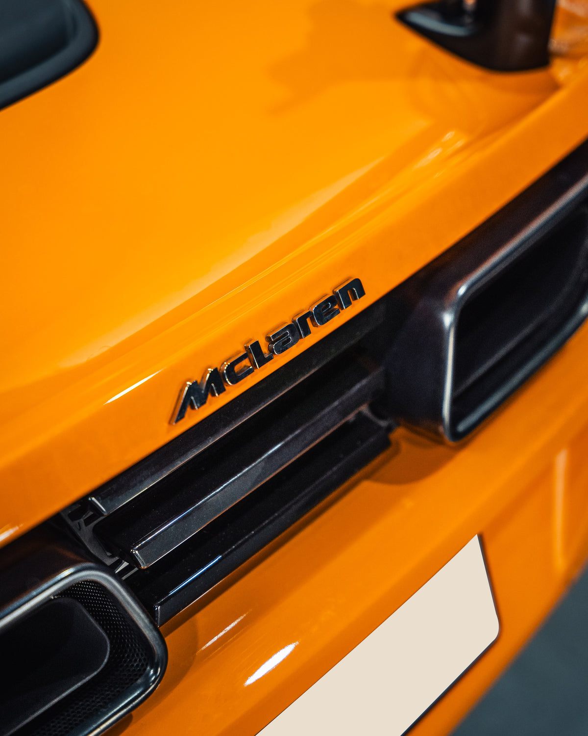 Orange McLaren rear badge and engine vents